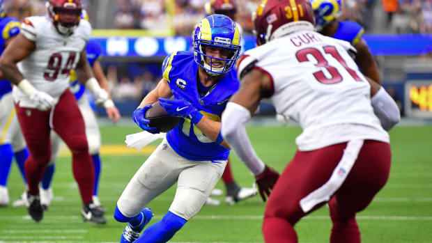 Dec 17, 2023; Inglewood, California, USA; Los Angeles Rams wide receiver Cooper Kupp (10) runs the ball against Washington Commanders safety Kamren Curl (31) during the first half at SoFi Stadium.